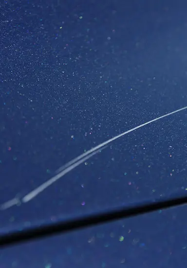 Swirl marks and fine scratches on car paint from improper washing