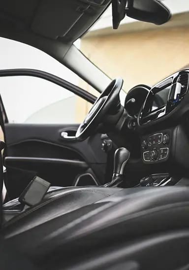 Car interior surface showing dirt staining and UV wear