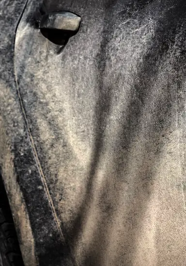 Dirt, grime, and brake dust bonded to car paint surface
