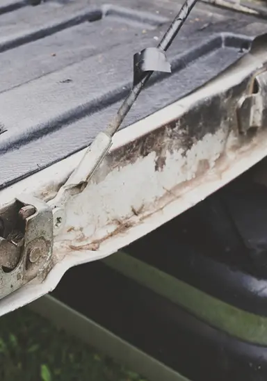 Rust and corrosion on truck bed from trapped moisture, road salt, and Calgary winter chemicals